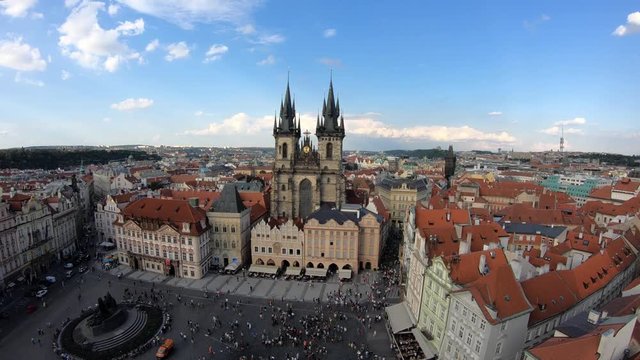 4K. People in Old Town Square and the Church of Our Lady before T&yacute;n, a gothic church in Old Town of Prague, Czech Republic. Views from the tower of the old town hall-Adrian