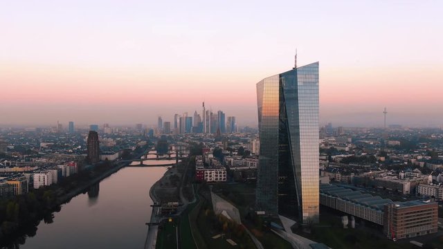 Frankfurt ECB Skyline Aerial Shot at early sunrise reflecting sun
