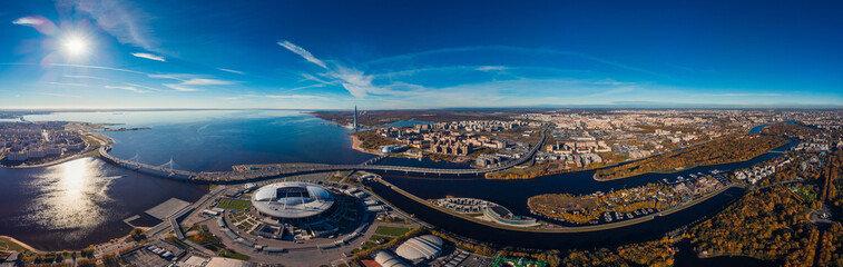 Skyscraper Gulf Finland. Autumn Park area. Residential complex. Stadium Zenit Arena. Top view air drone.