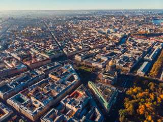 Obraz premium Urban landscape of Saint-Petersburg. Air view St. Isaac Cathedral, streets and water canals .