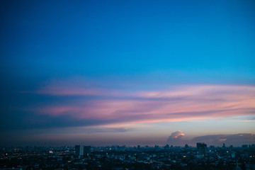 Colorful sky sunset over cityscape.