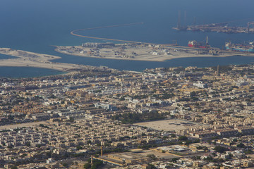 sea view in Dubai city, construction cranes