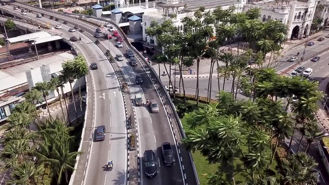 Aerial view in Malaysia, Kuala Lumpur of roads with cars and old KTM railway train station