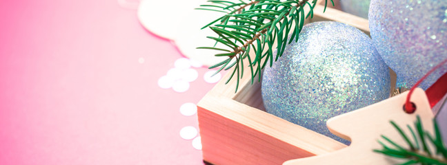 Fototapeta na wymiar Christmas pearl decoration balls pink background