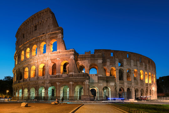 Fototapeta Colosseum in Rome, illumination at night with blue sky, Rome, Italy,