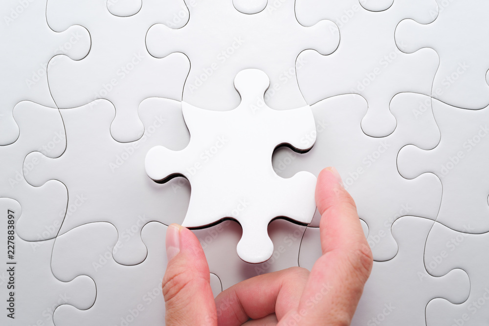 Poster Solving and completing the task. The correct solution. Putting last jigsaw puzzle piece. Assembling white jigsaw puzzle pieces.