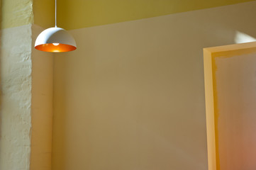  Vintage lamps with incandescent bulbs in the interior of the room with walls of warm color