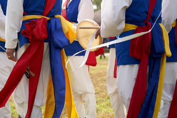 People in samulnori clothes, a traditional Korean folk game