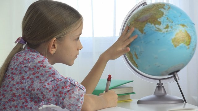 Child Studying Earth Globe, Girl Writing for School at Office, Learning Kid - Powered by Adobe