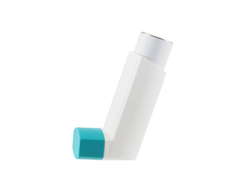 Asthma inhaler with blank label isolated on white background. Pharmaceutical product is used to treat lung inflammation and prevent asthma attack for asthma/COPD patients. Health and medical concept.