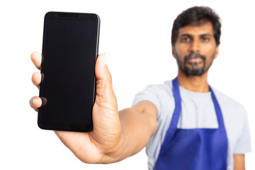 Hypermarket employee presenting touchscreen smartphone.
