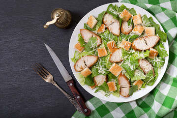 plate of chicken caesar salad, top view
