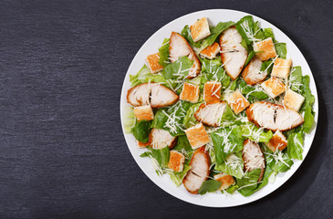 plate of chicken caesar salad, top view