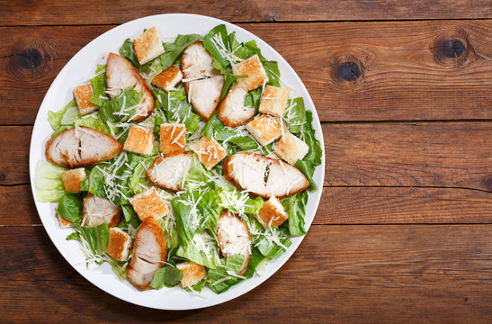 plate of chicken caesar salad, top view