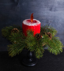Christmas candle cake with caramel flame decorated with pine tree