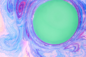 Abstract colored marble background. Stains of paint on the water.