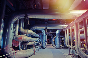Equipment, cables and piping as found inside of a modern industrial power plant