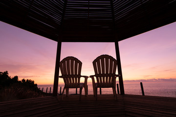 Beach bed with sun backlighting twilight time