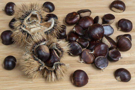 some chestnuts on the wooden table