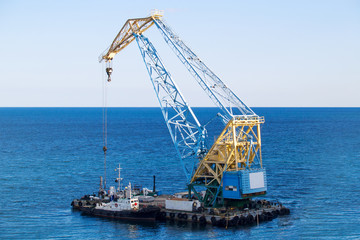 Ship near sea crane