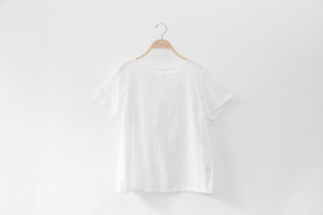 White  colour blouse is clothes hanger on white background.close up.