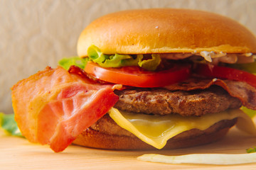 Home made tasty grilled burger on a wooden table