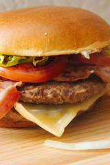 Home made tasty grilled burger on a wooden table