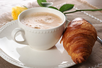 european breakfast coffee with milk and croissants