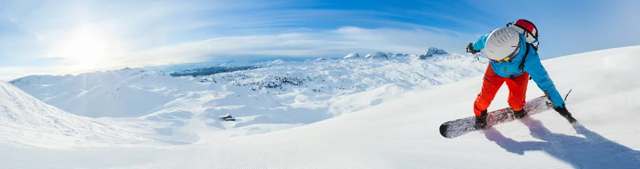 Fotobehang Snowboarder skiing downhill, panoramic format © Jag_cz