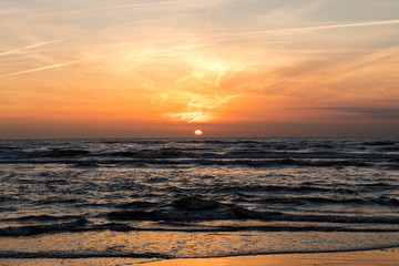 Fototapeta na wymiar Scenic View Of Sea Against Orange Sky