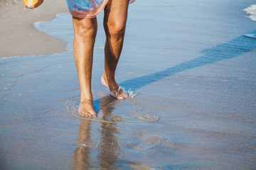 Woman walking on the sea beach