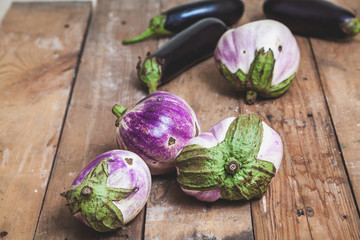 Several ripe eggplant varieties of bumbo lie on boards