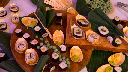 People group catering buffet food indoor in luxury restaurant with meat colorful fruits and vegetables