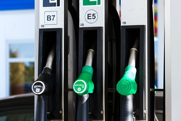 New fuel labeling at petrol station pumps with new EU labels, sunny day
