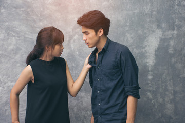 The couple husband and wife Asians are fighting. The two of them acting sense. Beautiful girl hand...