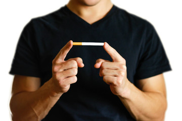 A man holding a cigarette. Close up. Isolated background