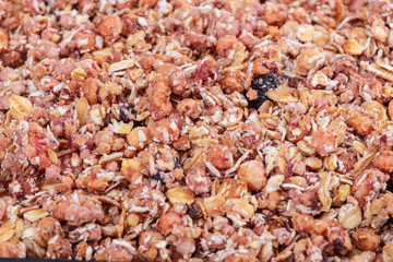 Organic homemade Granola Cereal with oats and almond. Texture oatmeal granola or muesli as background.