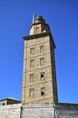 Fototapeta na wymiar Torre de Hercules, roman lighthouse in use. La Coruña, Spain, blue sky.
