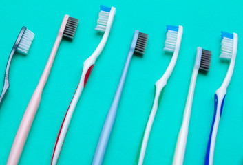 Flat lay composition with manual toothbrushes on color background, close up