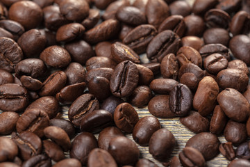 Coffee beans on wood background