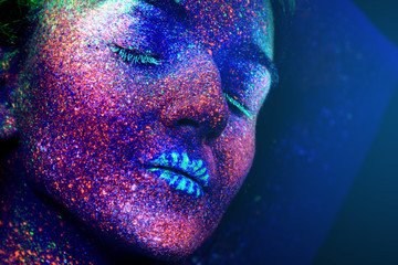 The girl's face, aliens asleep, ultraviolet make-up. Vertical. Beautiful.