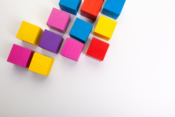 Colorful wooden building blocks isolated on white background