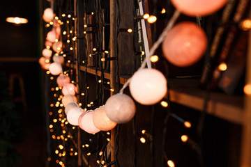 thread ball light bulbs.color light Christmas garland wood backgroundclose-up horizontal view