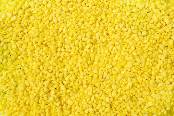 Texture of light yellow decorative pebbles.