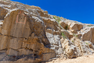 Metal net protecting rocks from falling down