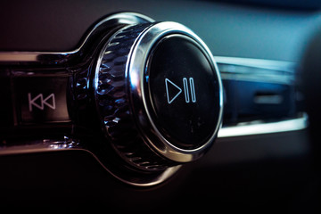 Luxury Car Sound Control Button Play and Pause. Interior of prestige modern car. Multimedia system...