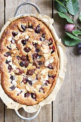 Plum cake. Spicy cake with plums, almond filling and cinnamon. Overhead view