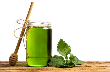 Mint leaf green honey in a jar isolated © creativefamily