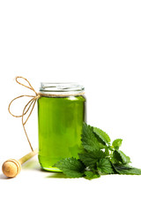 Mint leaf green honey in a jar isolated