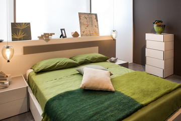 Bedroom interior with double bed and headboard